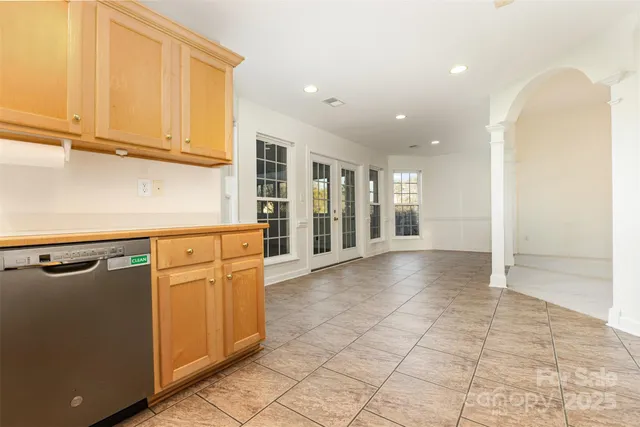 a view of a kitchen with windows