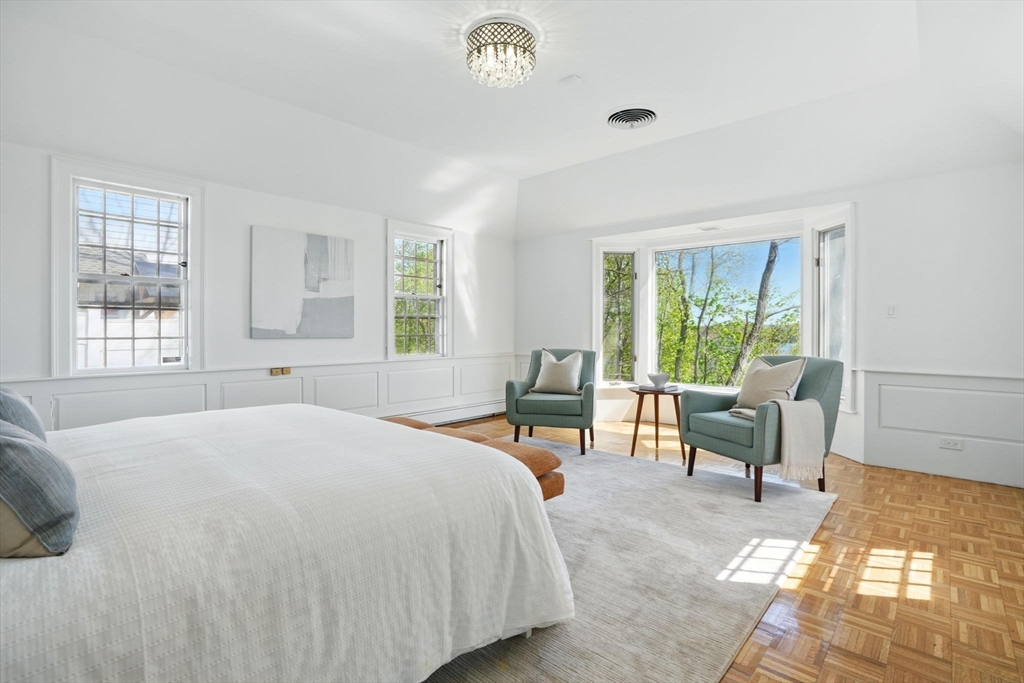 181 Grove Street Cambridge, MA 02138 - Photo 12 of 22 a bedroom with a bed and a couch