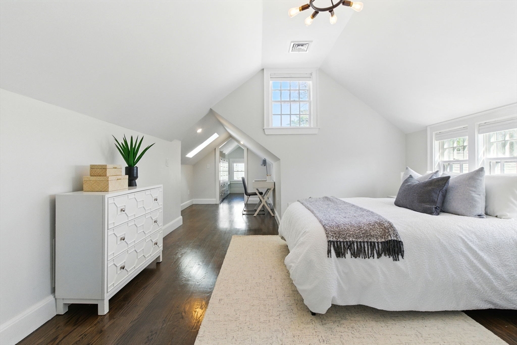 181 Grove Street Cambridge, MA 02138 - Photo 13 of 22 a living room with a bed furniture and a window