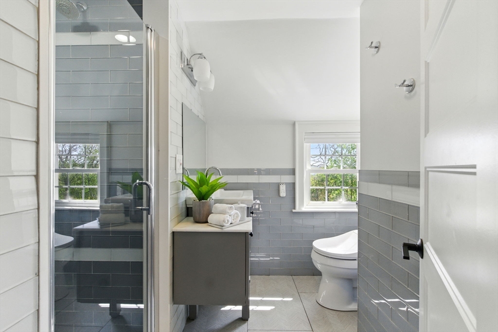 181 Grove Street Cambridge, MA 02138 - Photo 15 of 22 a white toilet sitting next to a bathroom sink