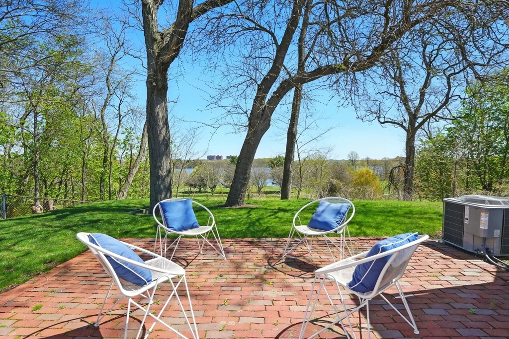 181 Grove Street Cambridge, MA 02138 - Photo 19 of 22 a table and chairs in backyard of the house