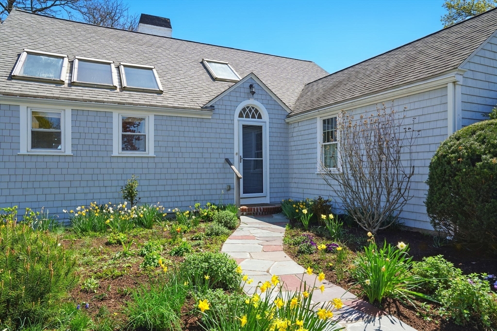 181 Grove Street Cambridge, MA 02138 - Photo 20 of 22 a front view of a house with garden
