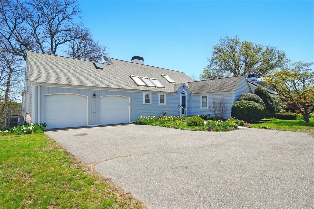 181 Grove Street Cambridge, MA 02138 - Photo 21 of 22 a front view of a house with a yard and garage