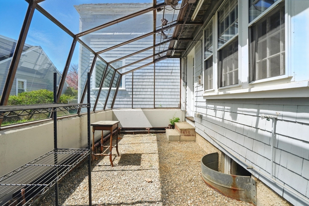 181 Grove Street Cambridge, MA 02138 - Photo 22 of 22 a balcony view with a sink and wooden floor
