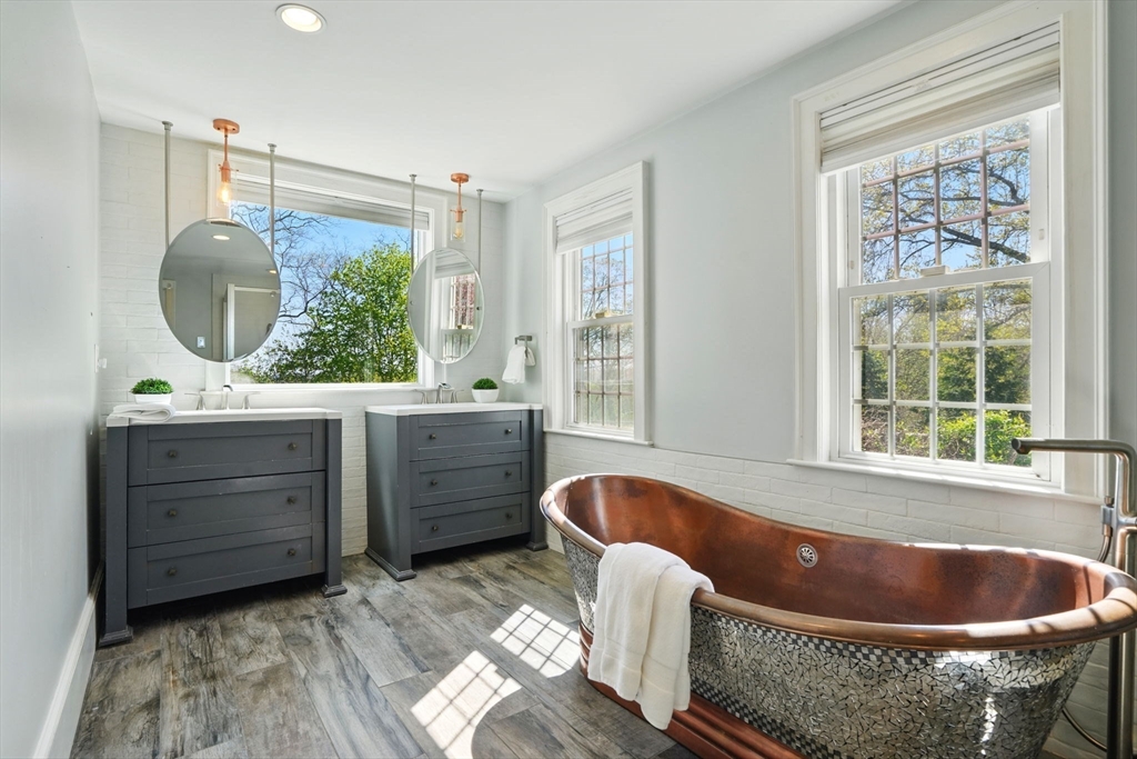 181 Grove Street Cambridge, MA 02138 - Photo 9 of 22 a bath tub sitting in a bathroom and sink