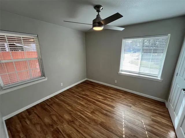 a white toilet and shower in a bathroom