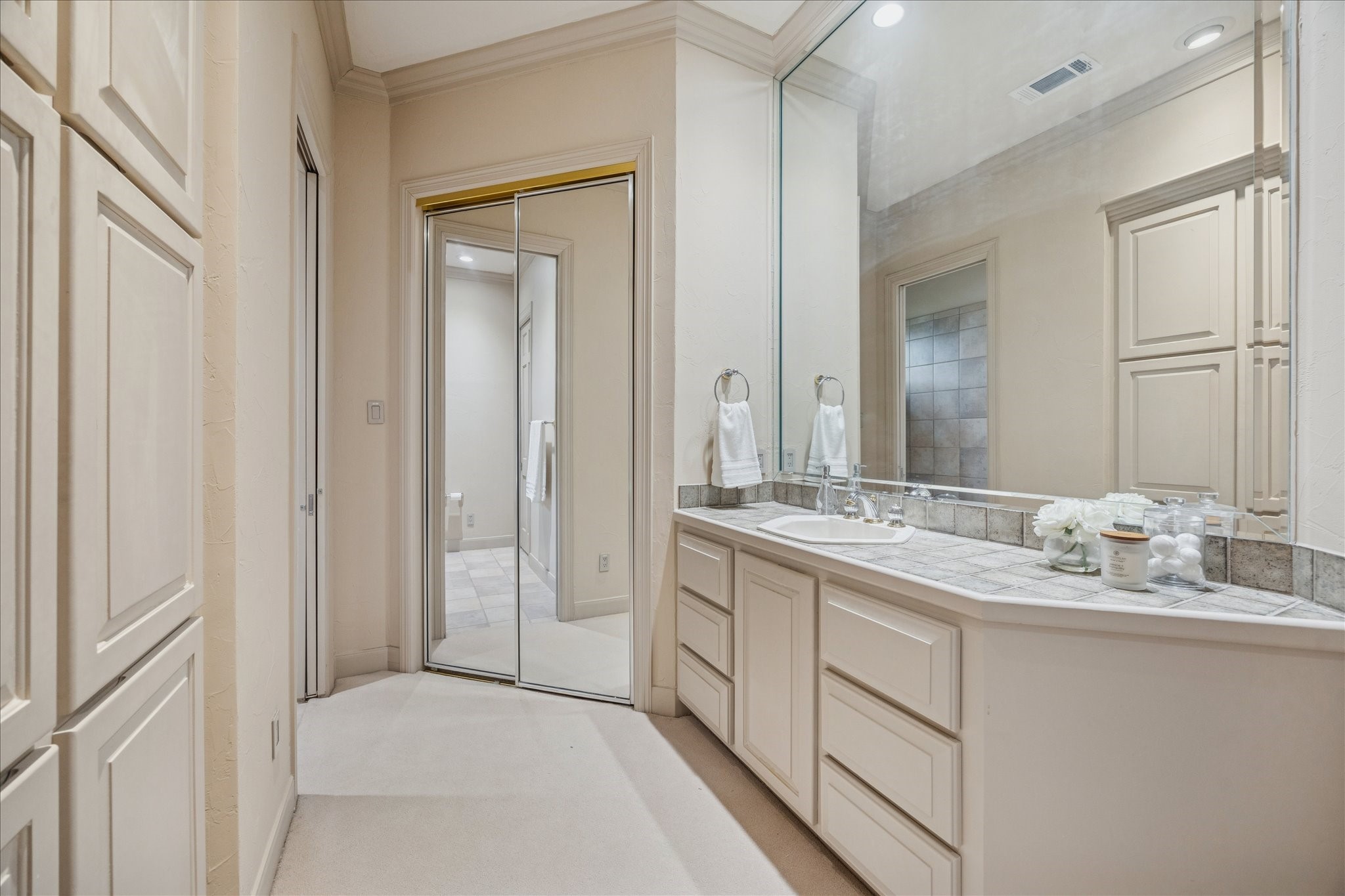 6 Mott Lane Houston, TX 77024 - Photo 36 of 49 a bathroom with a sink and a mirror