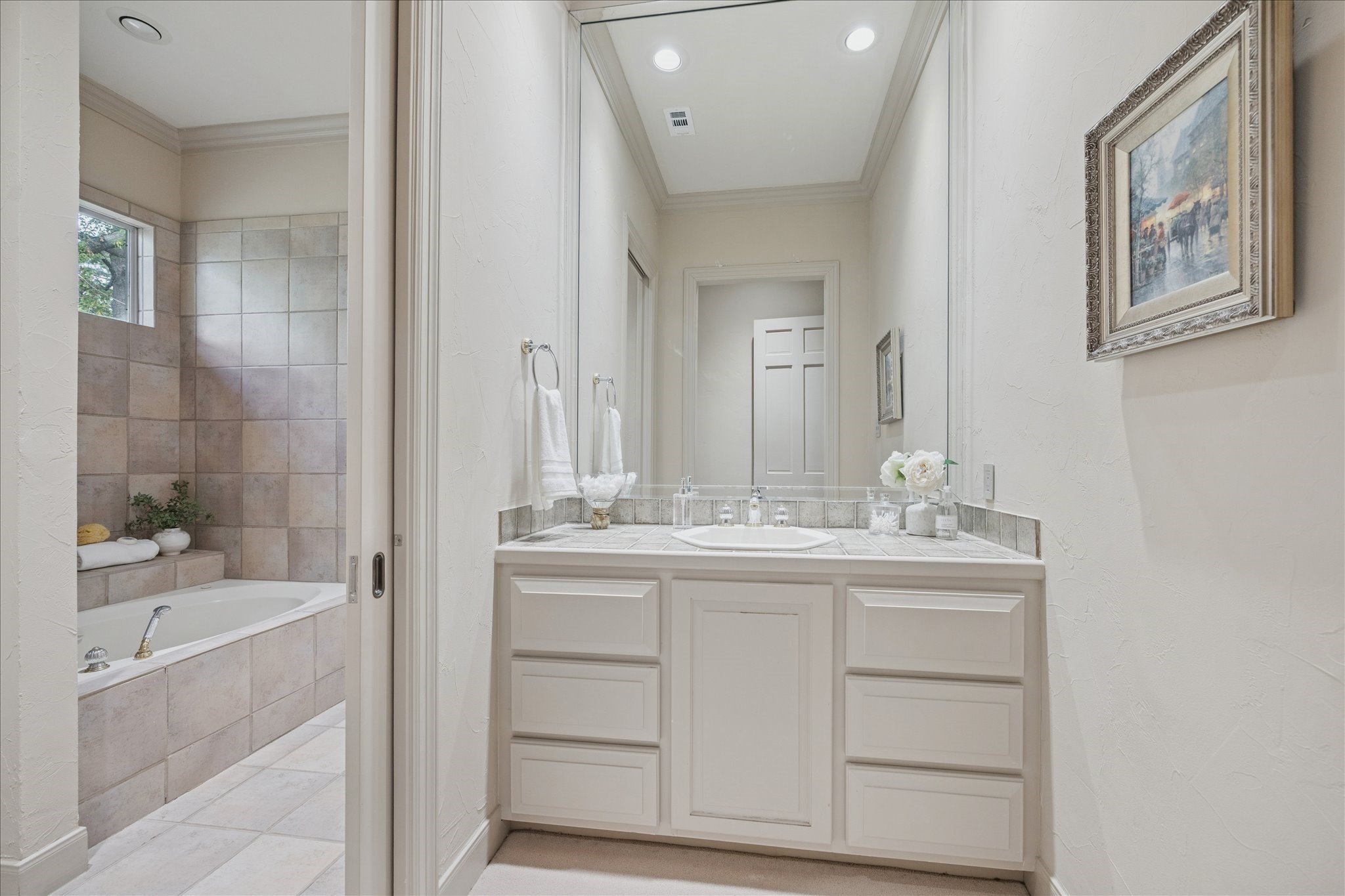 6 Mott Lane Houston, TX 77024 - Photo 37 of 49 a bathroom with a bathtub sink and mirror