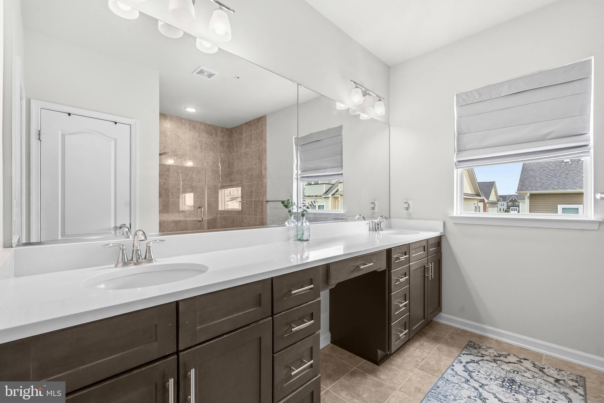 7715 Cresap Lane Hanover, MD 21076 - Photo 23 of 42 a bathroom with a double vanity sink and a mirror