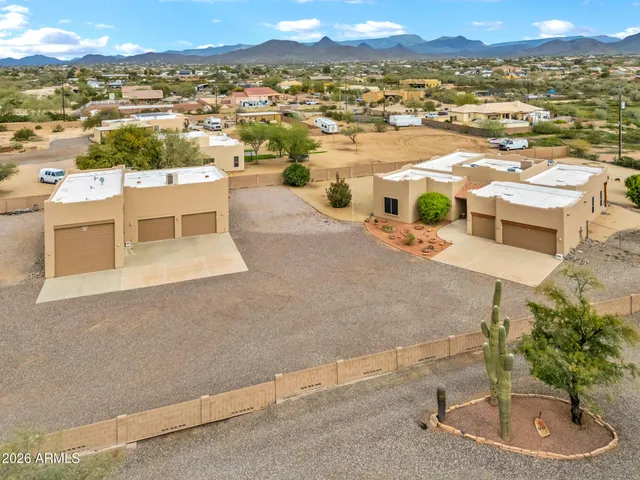 an aerial view of a house with a ocean view