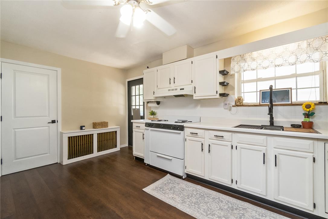 331 East Lizard Creek Road Lehighton, PA 18235 - Photo 21 of 37 A well-equipped kitchen showcases classic white cabinetry and dark wood flooring.