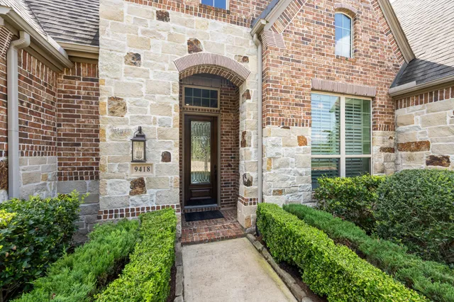 a front view of a house with large windows