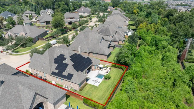 an aerial view of house with yard