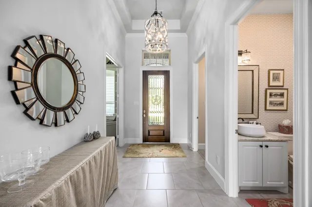 a view of a hallway with painted walls and windows