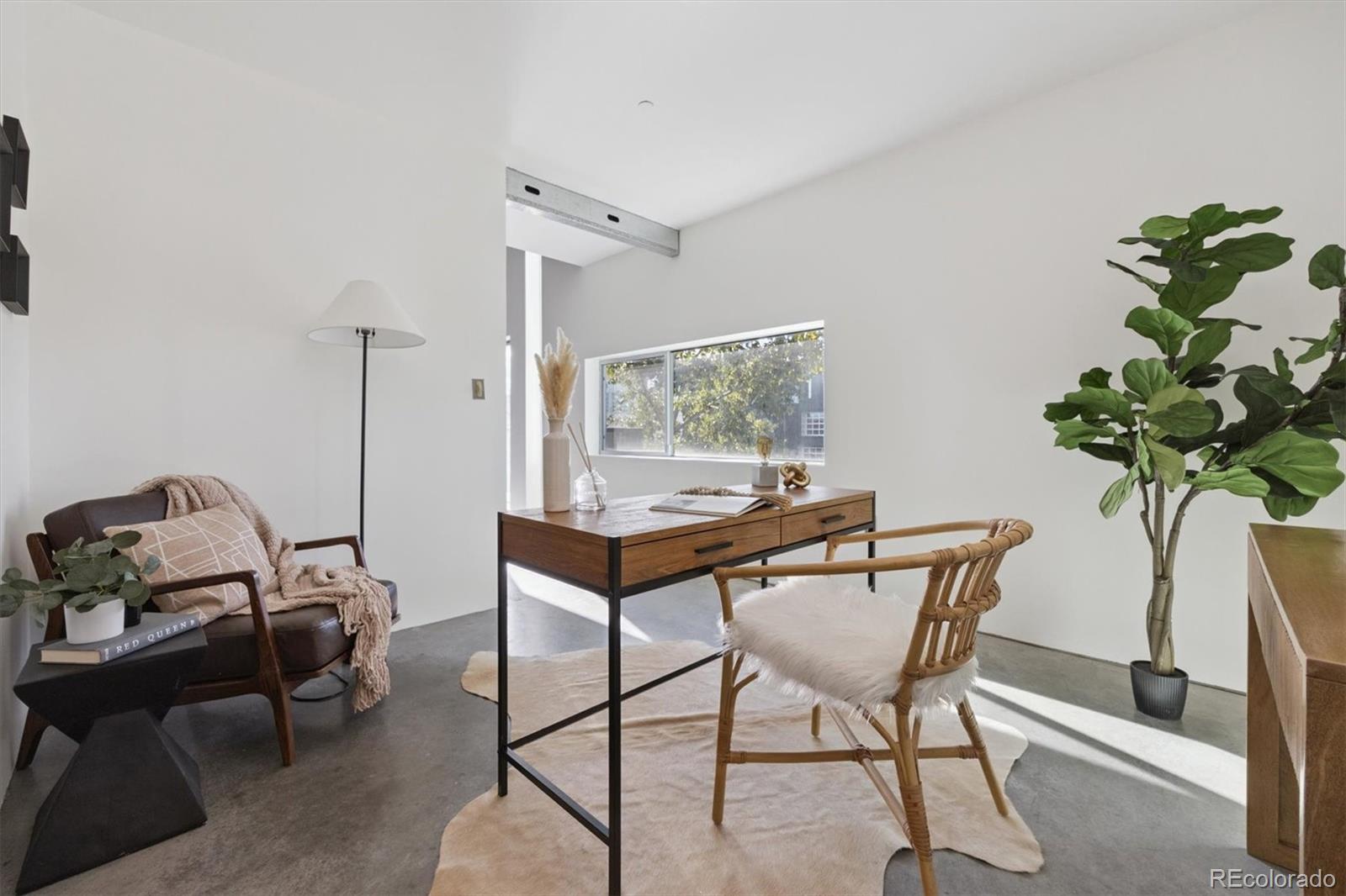 3457 Ringsby Court, Unit 320 Denver, CO 80216 - Photo 22 of 41 a view of a workspace with furniture