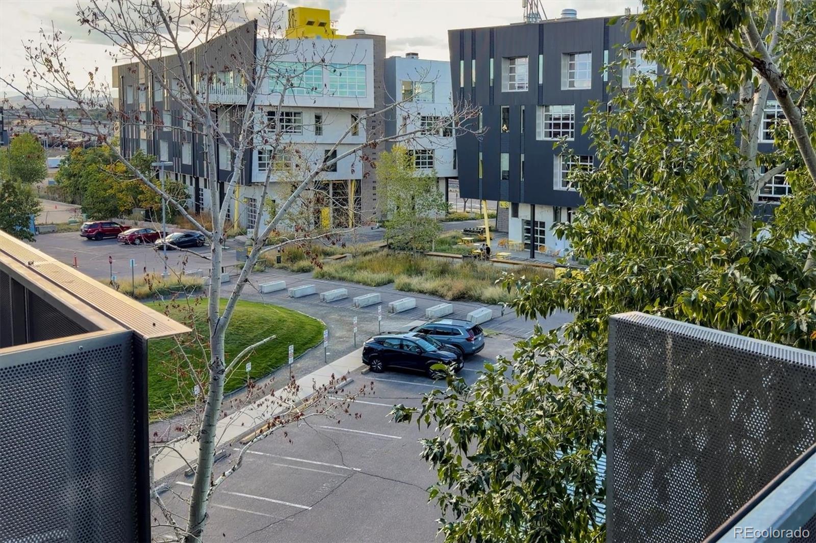 3457 Ringsby Court, Unit 320 Denver, CO 80216 - Photo 29 of 41 a view of a building and yard