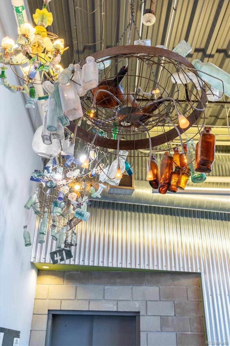 3457 Ringsby Court, Unit 320 Denver, CO 80216 - Photo 36 of 41 a front view of a house with a yard