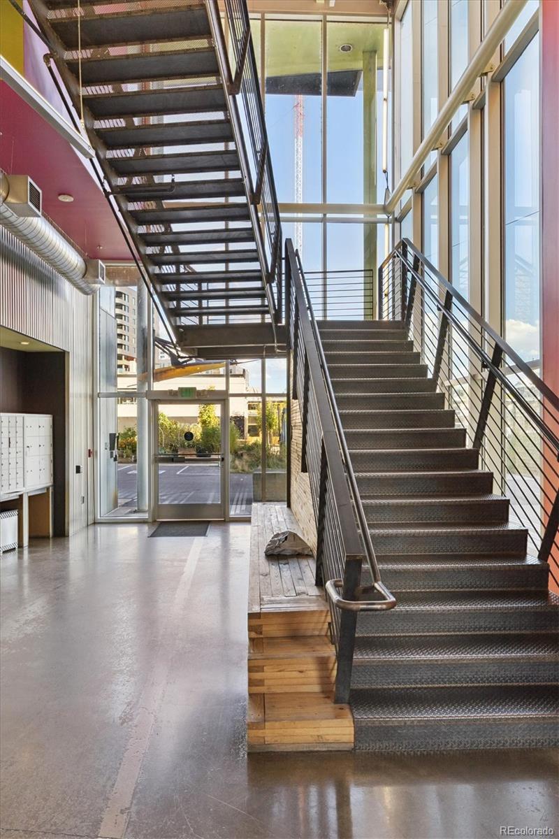 3457 Ringsby Court, Unit 320 Denver, CO 80216 - Photo 37 of 41 a view of entryway and hall with wooden floor
