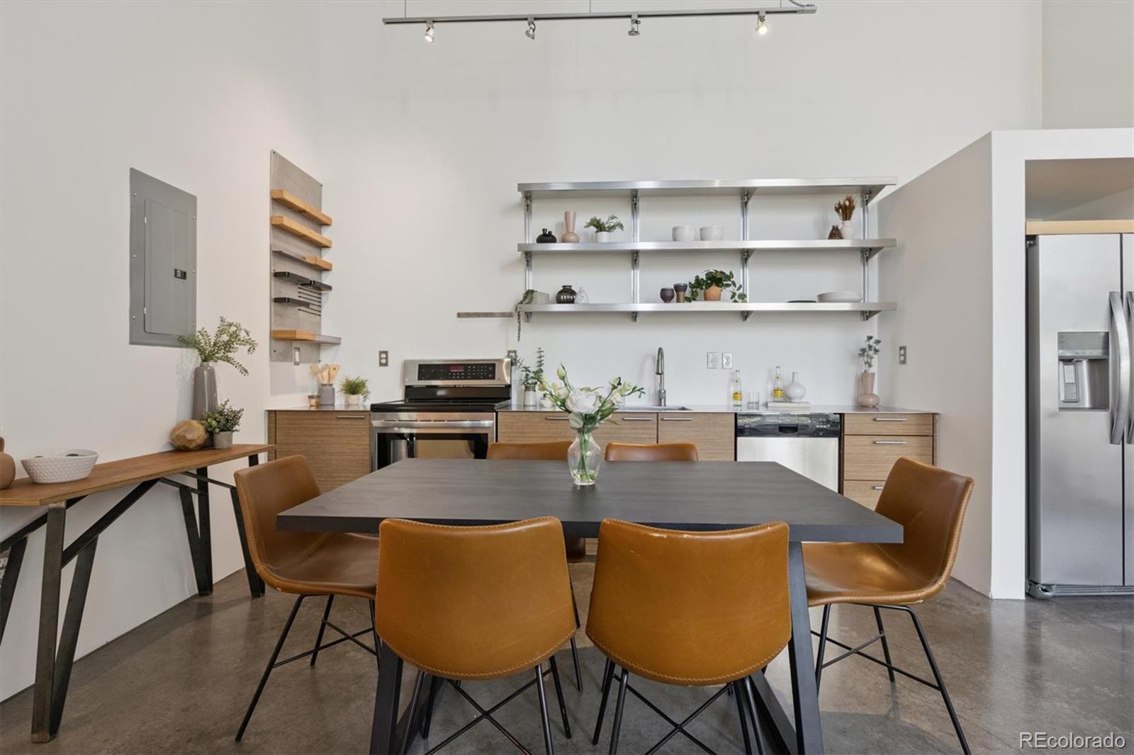 3457 Ringsby Court, Unit 320 Denver, CO 80216 - Photo 7 of 41 a view of a dining room with furniture