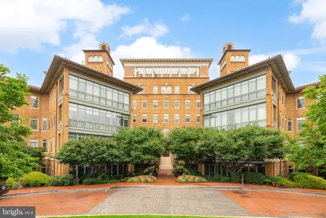 a view of a street with a building in the background