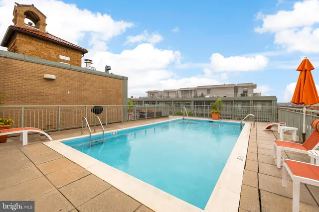 a view of a balcony with two chairs