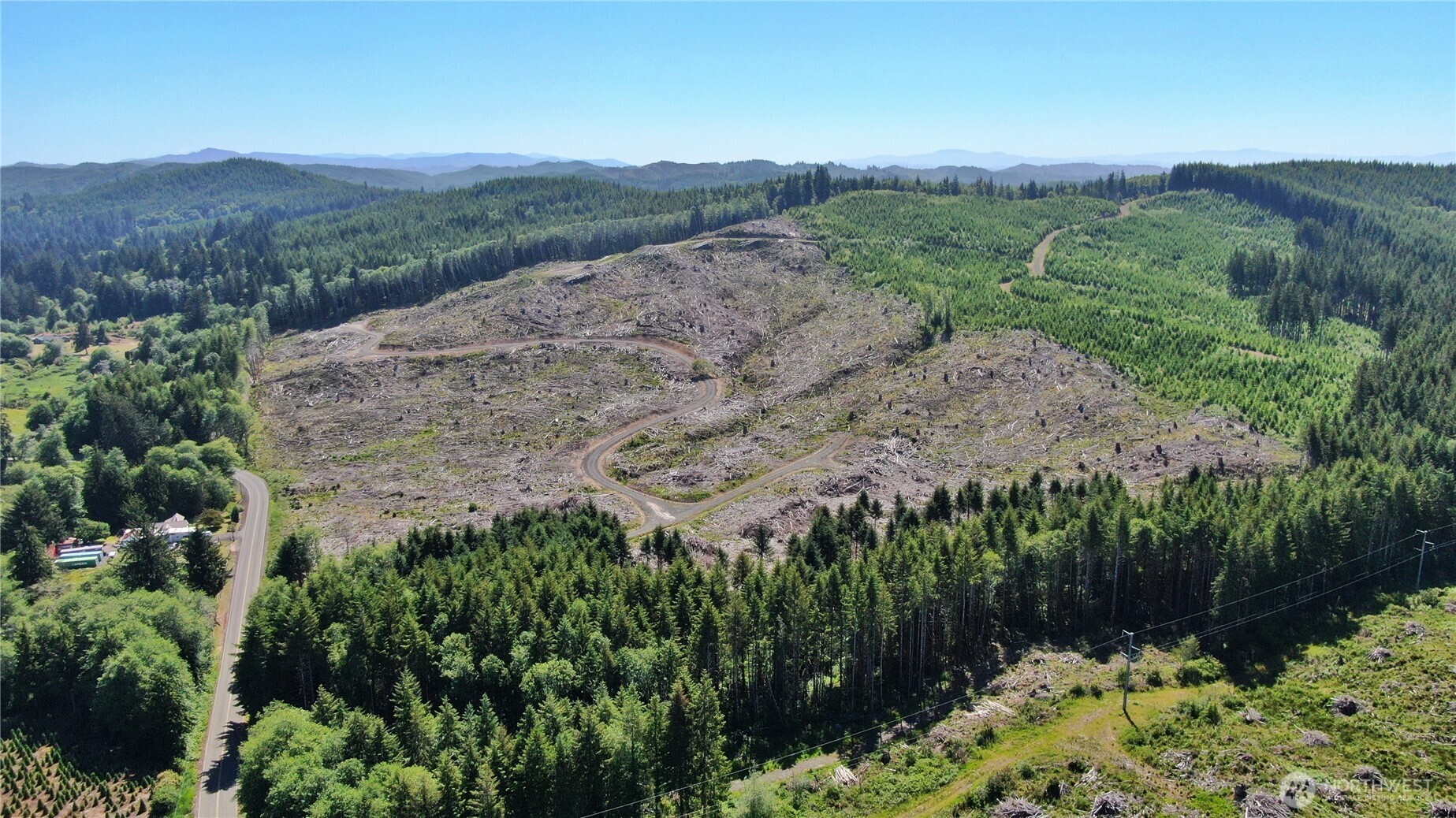 -nka Smith Creek Road Raymond, WA 98577 - Photo 3 of 14 an aerial view of mountain with residential house in background