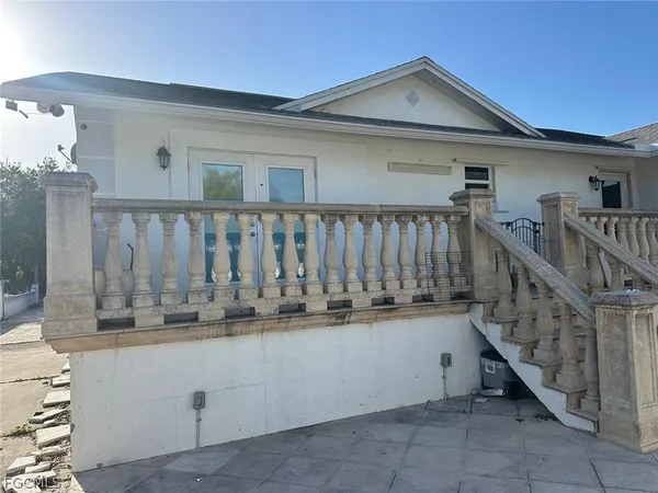 a view of wooden house with a large window