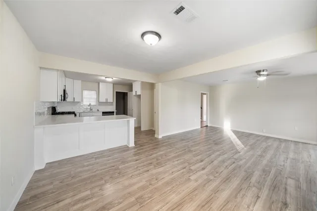 a view of kitchen with wooden floor