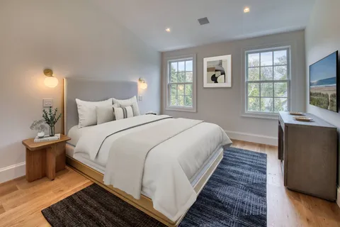 a bedroom with bed and window