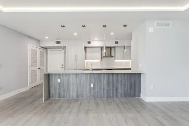 a view of kitchen with wooden floor