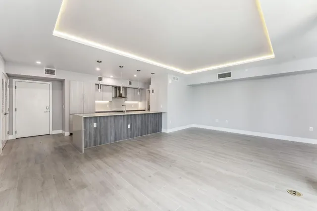 a view of kitchen with wooden floor