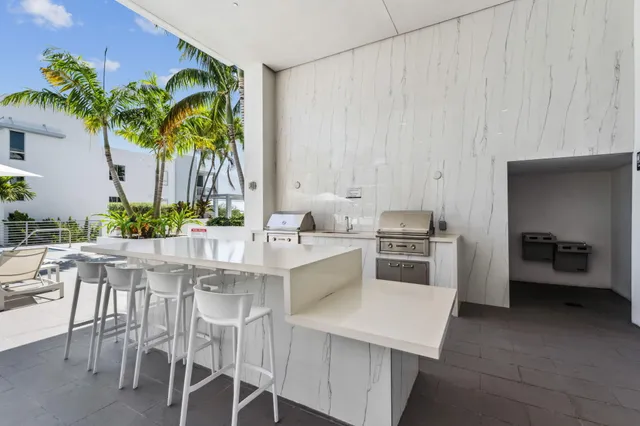 a kitchen with a table and chairs