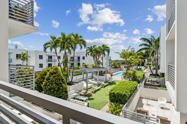 a view of a yard with potted plants