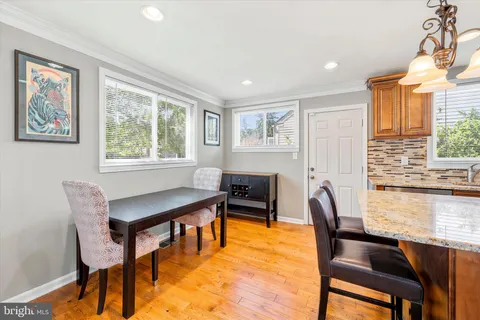 a view of a dining room with furniture and window