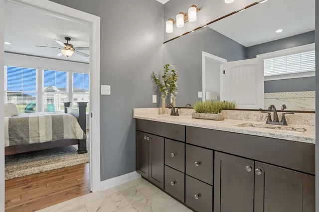 a spacious bathroom with a double vanity sink mirror and double