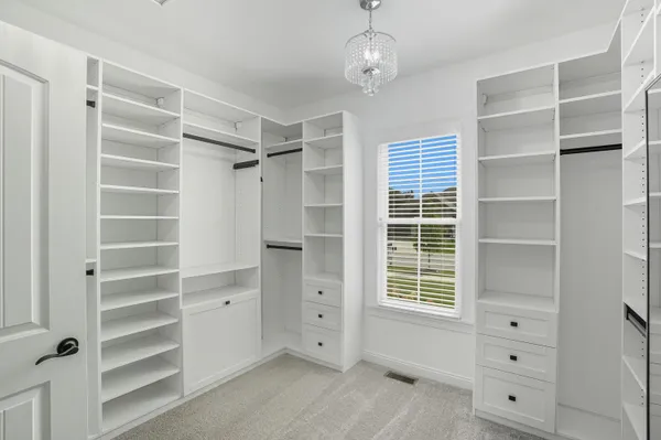 a bathroom with a sink a vanity and a mirror