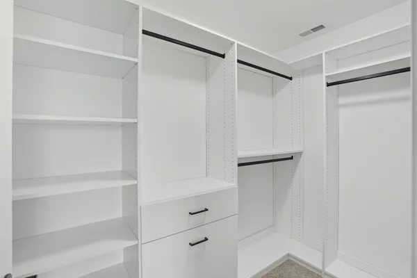 a bedroom with furniture and windows