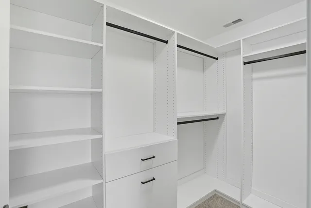 a bedroom with furniture and windows