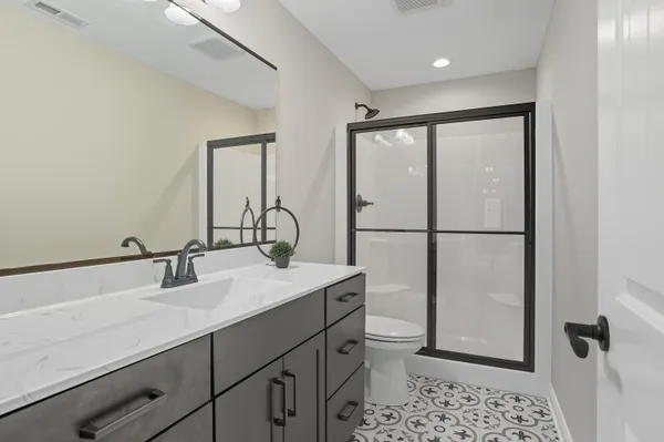 a view of a patio with a table chairs and a backyard