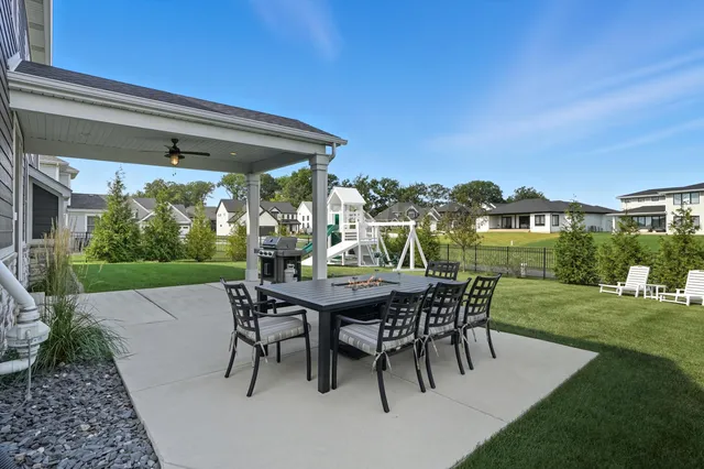 a front view of house with a garden and patio