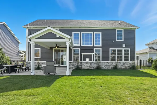 an aerial view of a house with a swimming pool yard and outdoor seating