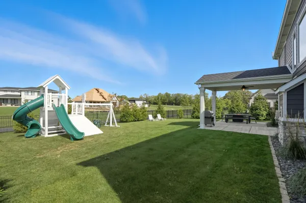 an aerial view of a house with a garden and trees