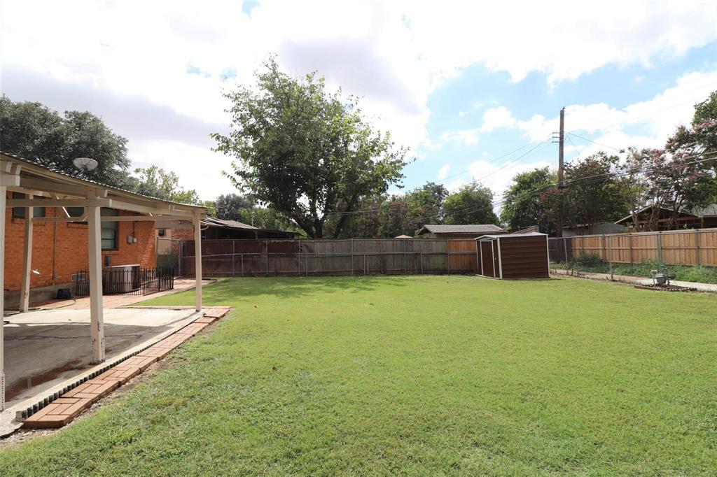 9107 Rustown Drive Dallas, TX 75228 - Photo 25 of 30 a backyard of a house with lots of green space
