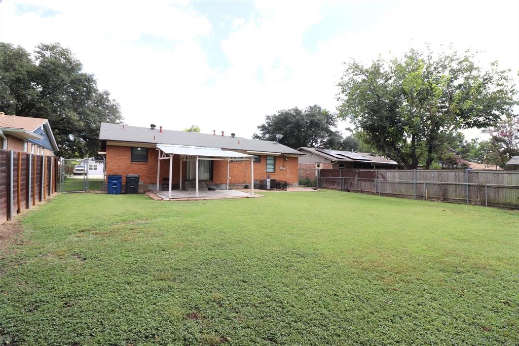 9107 Rustown Drive Dallas, TX 75228 - Photo 26 of 30 a view of a house with a yard and sitting area