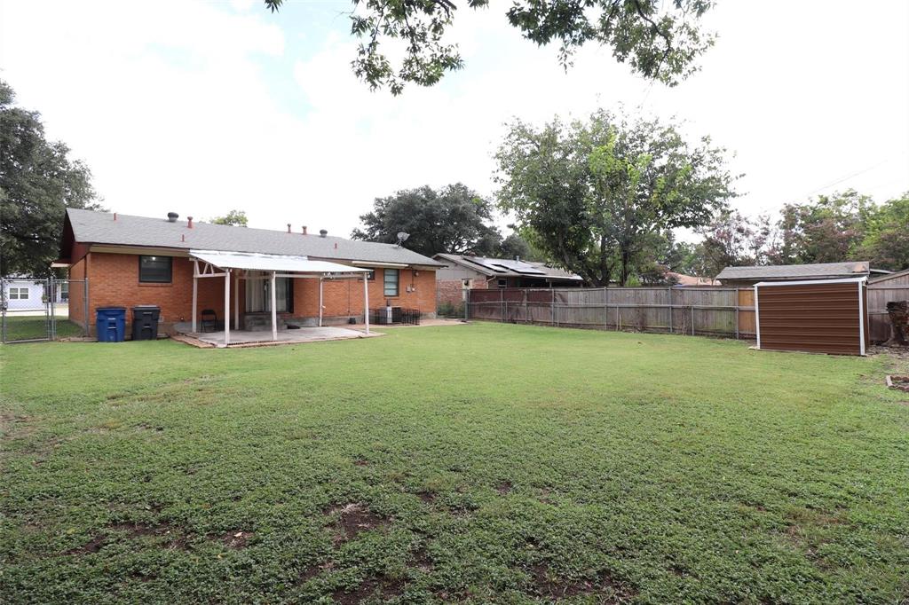9107 Rustown Drive Dallas, TX 75228 - Photo 27 of 30 a front view of house with yard and seating area