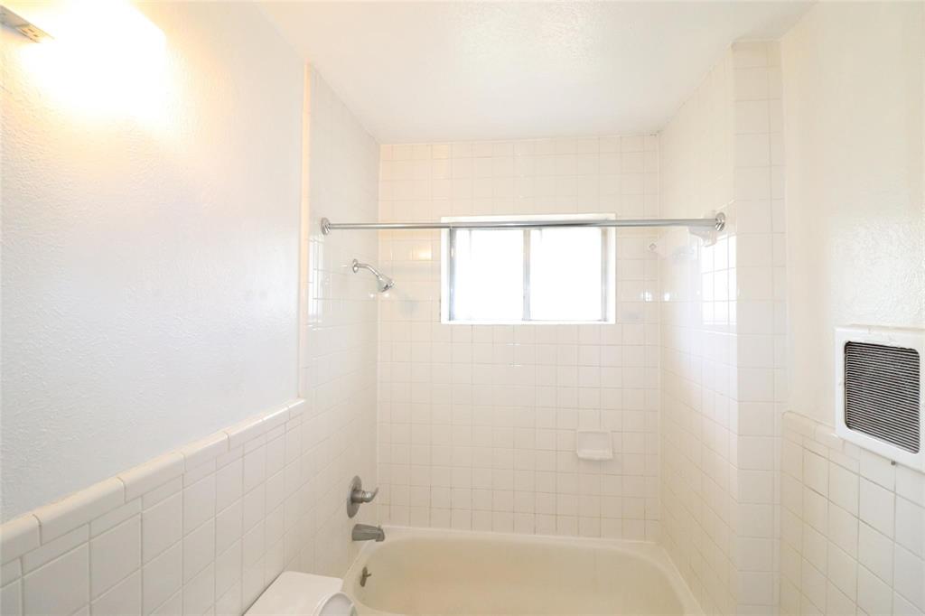 9107 Rustown Drive Dallas, TX 75228 - Photo 10 of 30 a bathroom with a bathtub