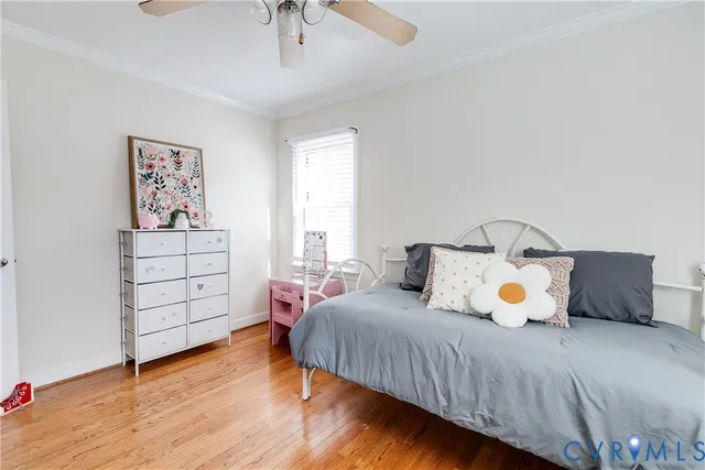 a bed room with a bed and a window