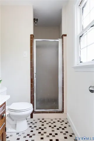 a bathroom with a sink toilet and a mirror
