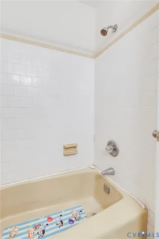 a large kitchen with stainless steel appliances granite countertop a sink dishwasher a stove a dining table and chairs with wooden floor