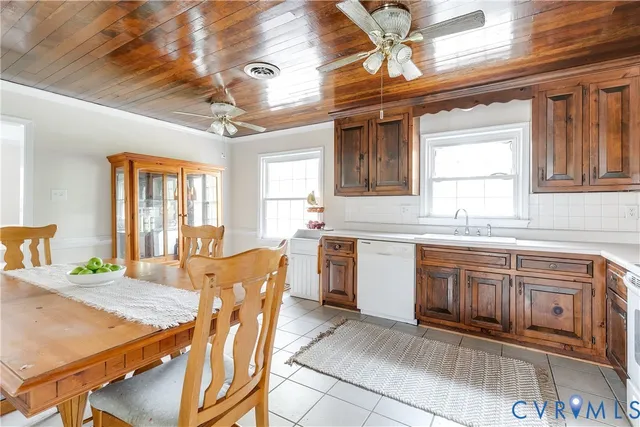 a kitchen with stainless steel appliances granite countertop a sink and cabinets